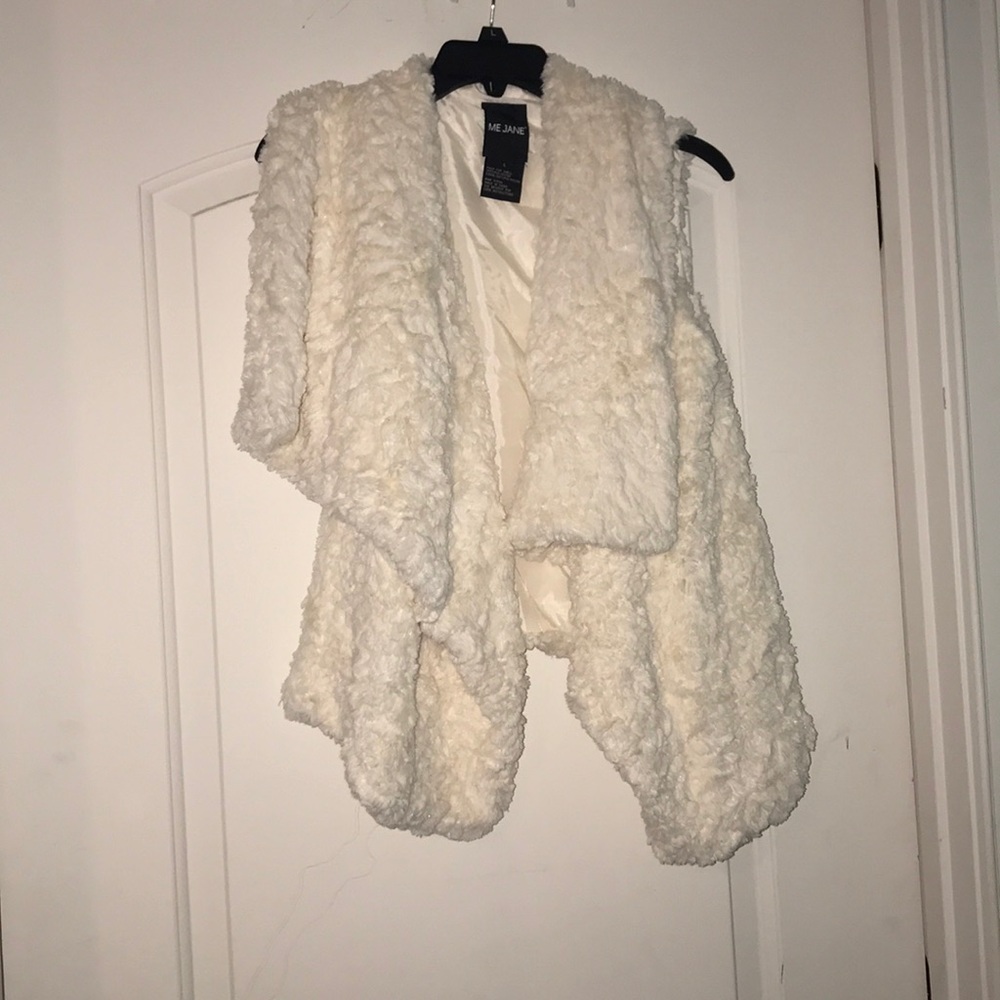 A white faux fur vest